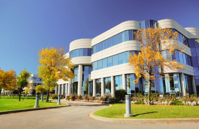 Multi-story corporate office building with glass windows
